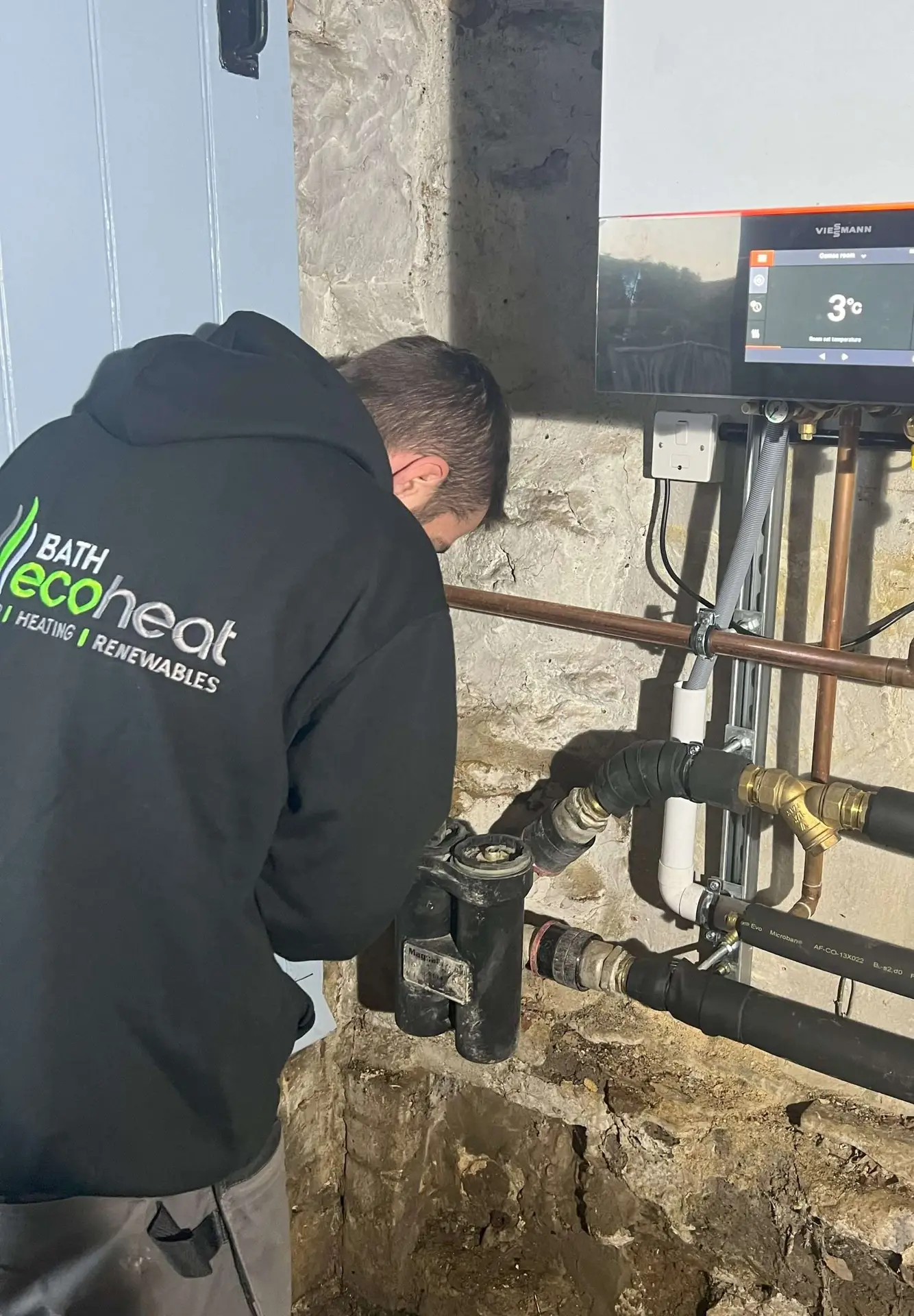 Engineer carrying out boiler servicing in Keynsham home