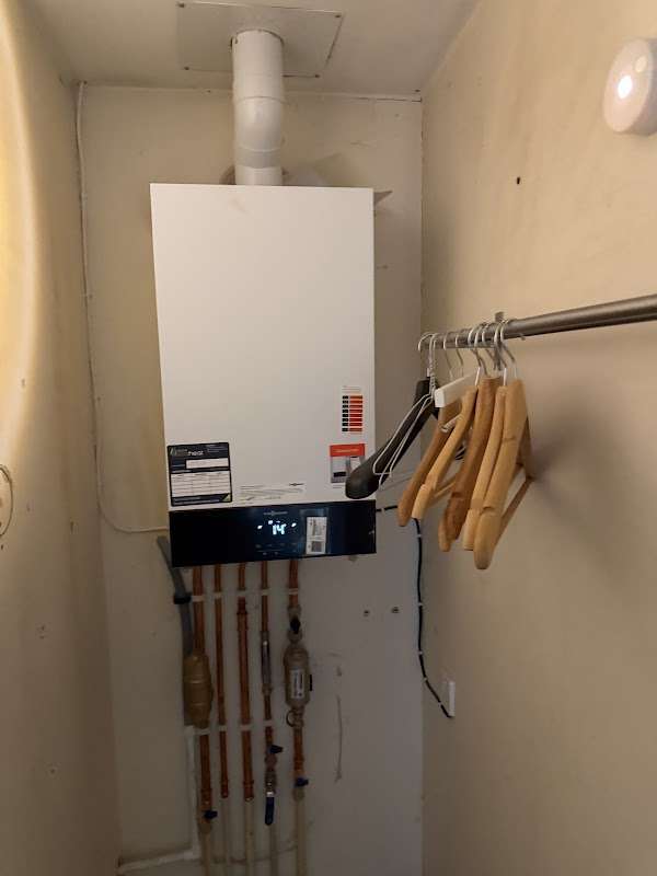 Cupboard install with a vertical flue